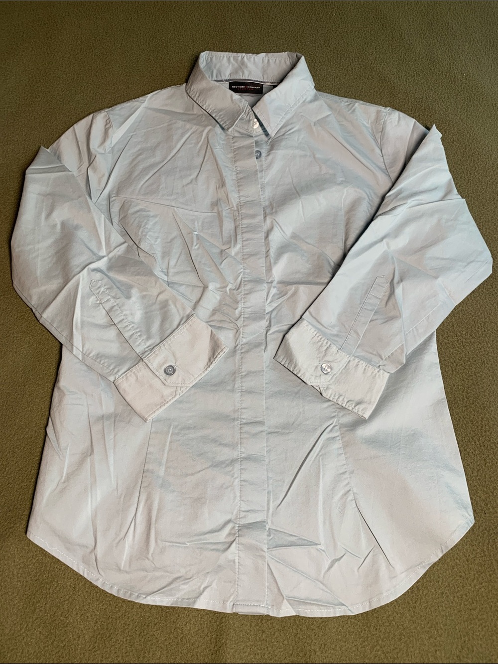 New York & Co blue button down shirt. 3/4 sleeves. Stretch. Size M.